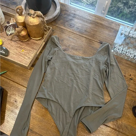 Lululemon Athletica Green Asymmetrical Long Sleeve Bodysuit - Picture 1 of 6